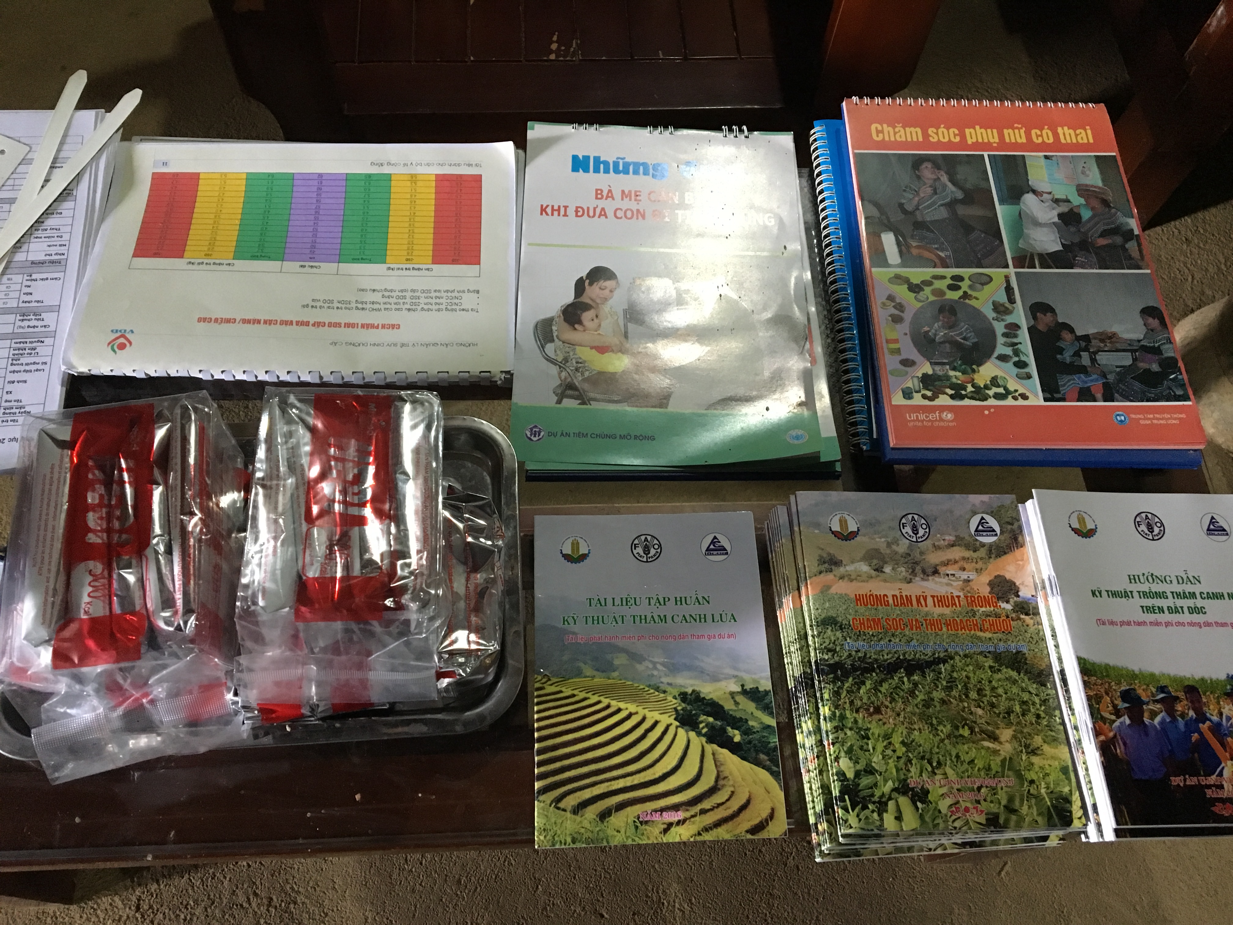 Training materials and supplies displayed at Community Child Feeding Club.